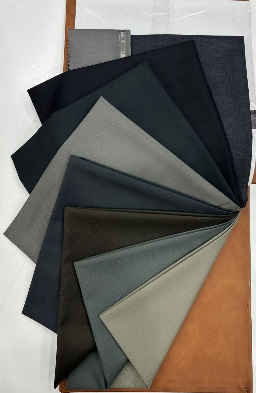 Fanned display of poly-wool suiting fabric samples